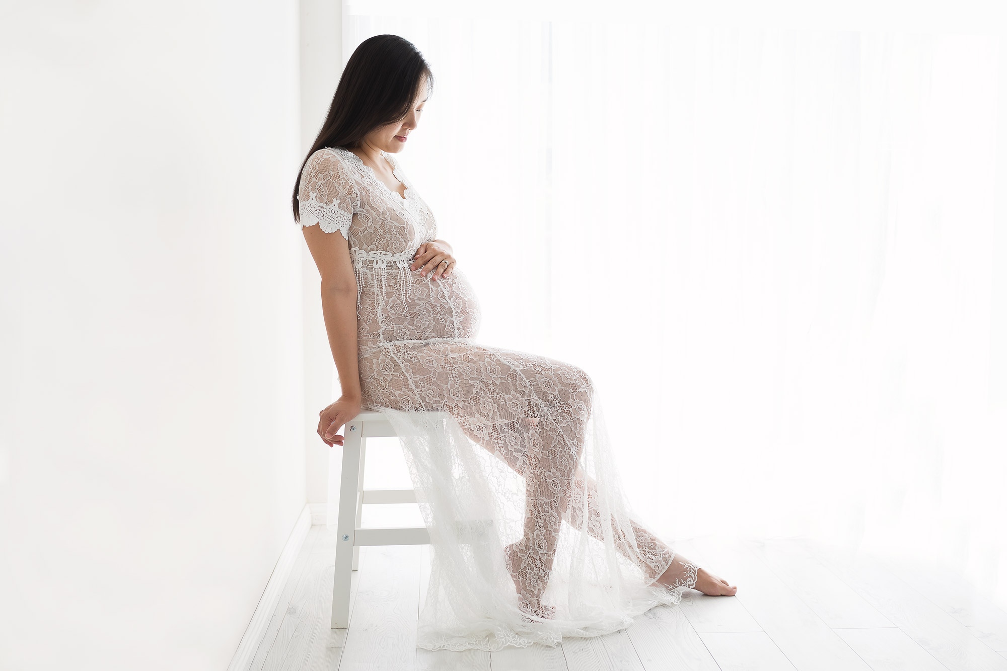 maternity session lady in white lace dress